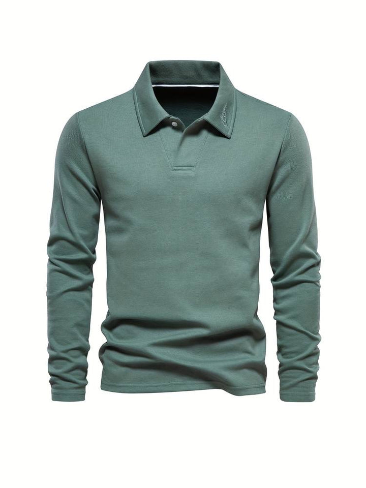 Polo de manga larga para hombre en tono gris. Prenda esencial de otoño invierno, combina elegancia clásica y confort diario.