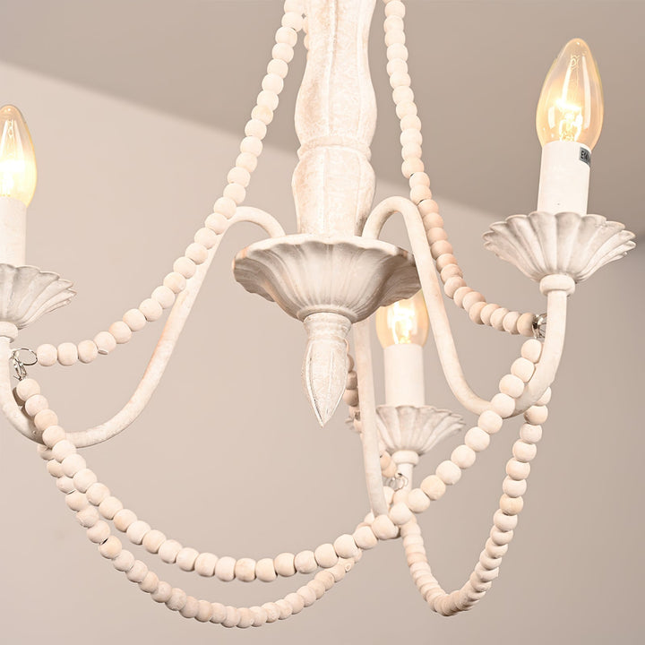 Candelabro colgante moderno de tres brazos curvos, acabado mate blanco antiguo. Elegancia en tu hogar.