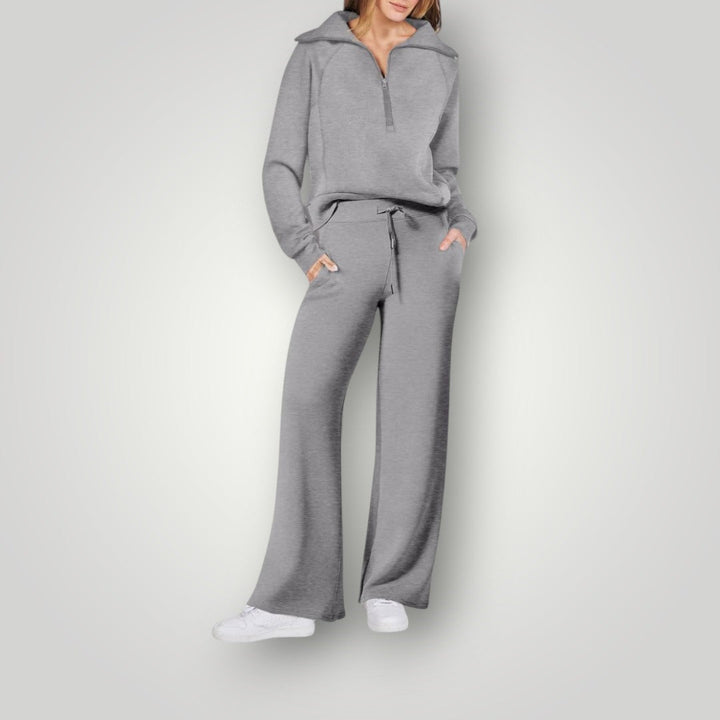 Conjunto loungewear de mujer gris, suéter y jogger, comodidad y estilo elegante para relajarse en casa.