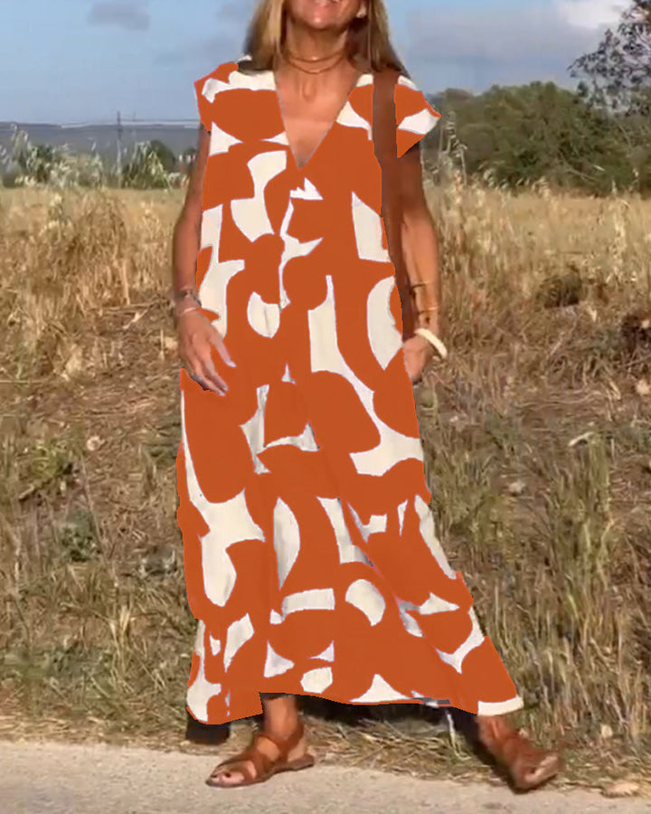 Vestido estampado de mujer, corte fluido con escote V, perfecto para un look casual de verano.