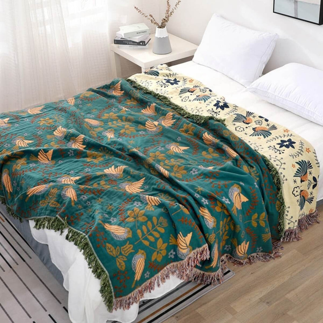 Manta escandinava reversible de algodón con diseño de pájaros, ideal para la decoración y confort del hogar.