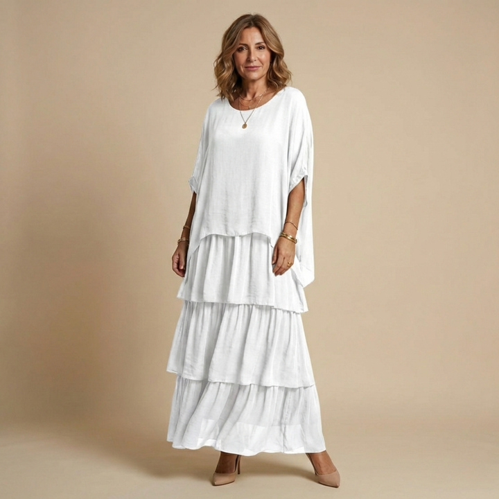 Vestido largo de mujer, estilo fluido y cómodo, con capas elegantes y manga suelta. Moda femenina versátil.