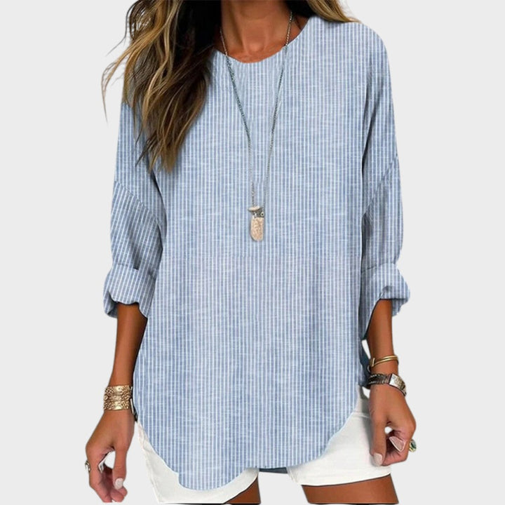 Blusa de rayas manga larga para mujer, estilo casual chic. Ideal para oficina o uso diario. Moda versátil primavera.