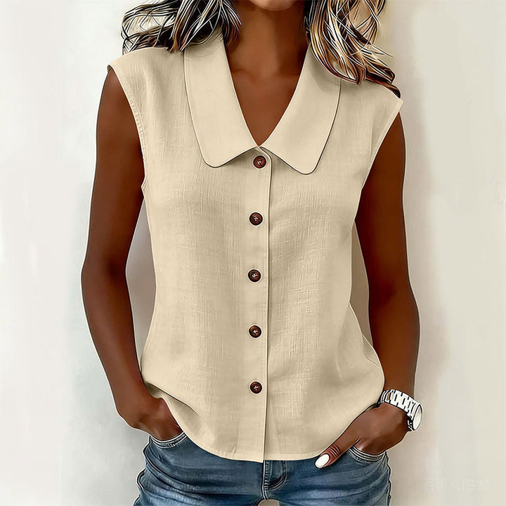 Blusa elegante sin mangas con cuello V y botones, perfecta para combinar en outfits chic de oficina o noche.