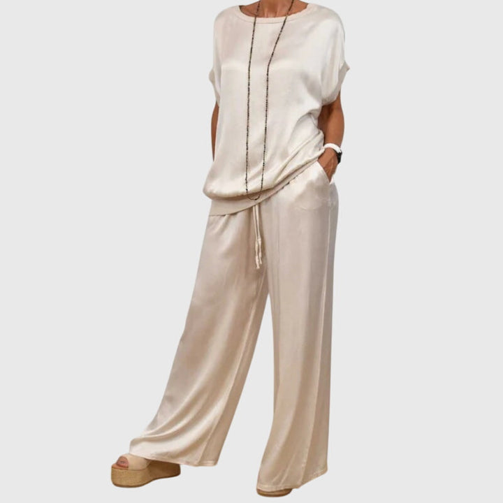 Conjunto elegante de dos piezas para mujer, camisa suelta y pantalón ancho. Versátil y cómodo.