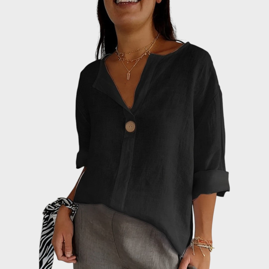 Blusa de lino natural para mujer, escote V. Textura fresca y transpirable, perfecta para un estilo relajado de verano.