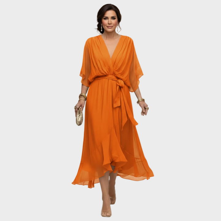 Vestido fluido de verano para mujer con escote en V. Un estilo elegante y fresco para la moda femenina.