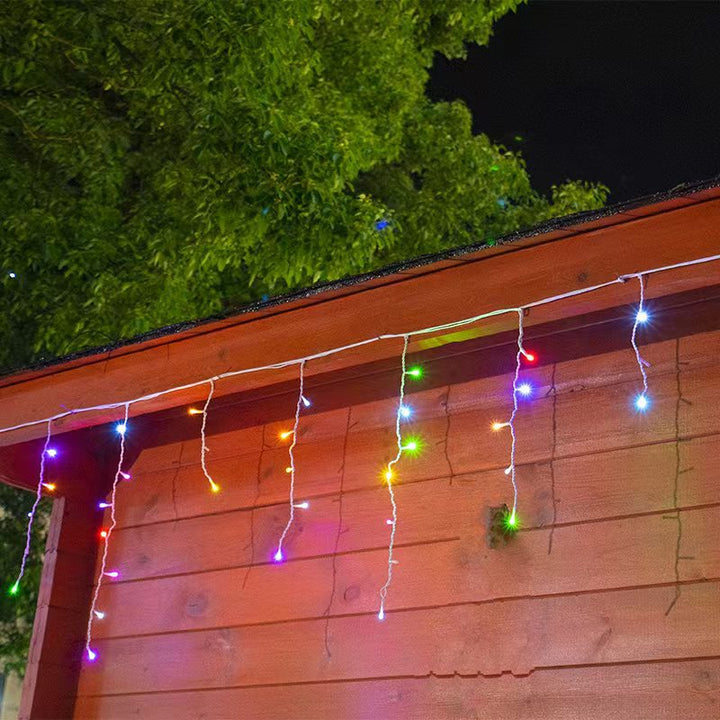 Luces LED exterior 50m carámbano blanco cálido. Iluminación decorativa para Navidad en jardín y terraza.