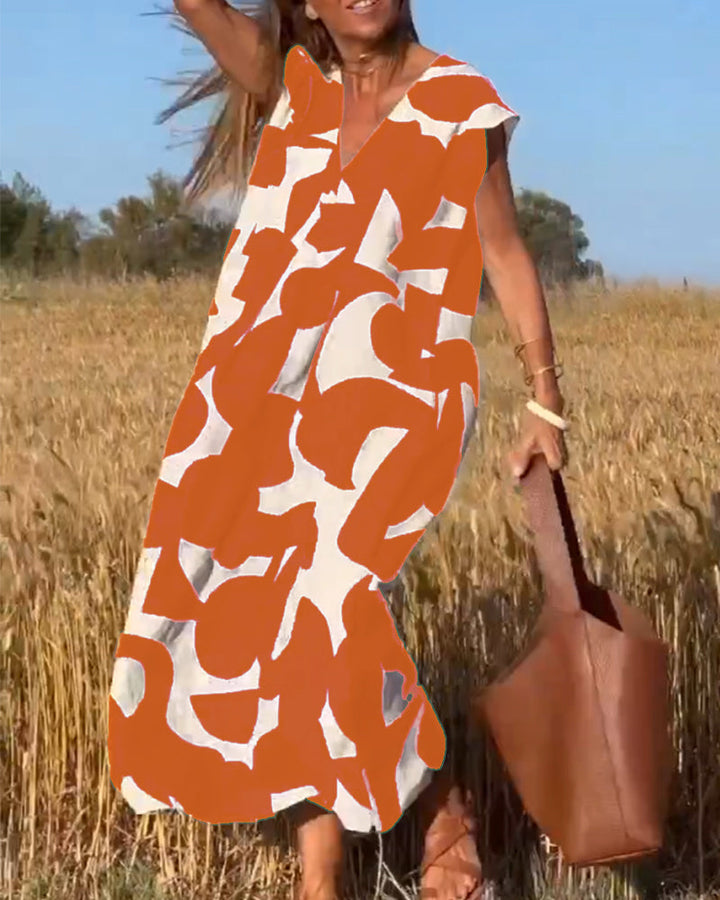 Vestido casual de mujer, estampado vibrante, diseño fluido con escote V. Ideal para el día a día.