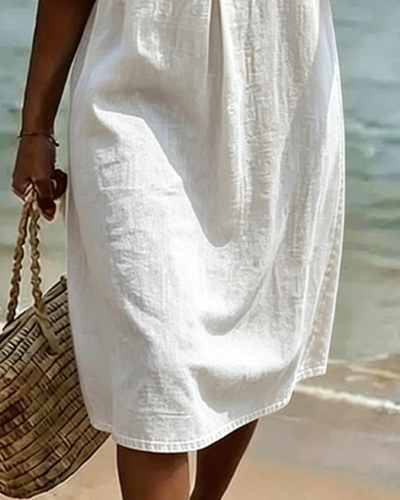 Moda de verano: Vestido de mujer fluido con mangas acampanadas. Perfecto para un look ligero y estiloso.