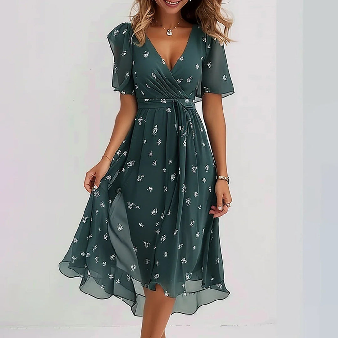 Vestido de fiesta midi estampado y cruzado para invitada. Estilo fresco y chic, ideal para eventos especiales de verano.