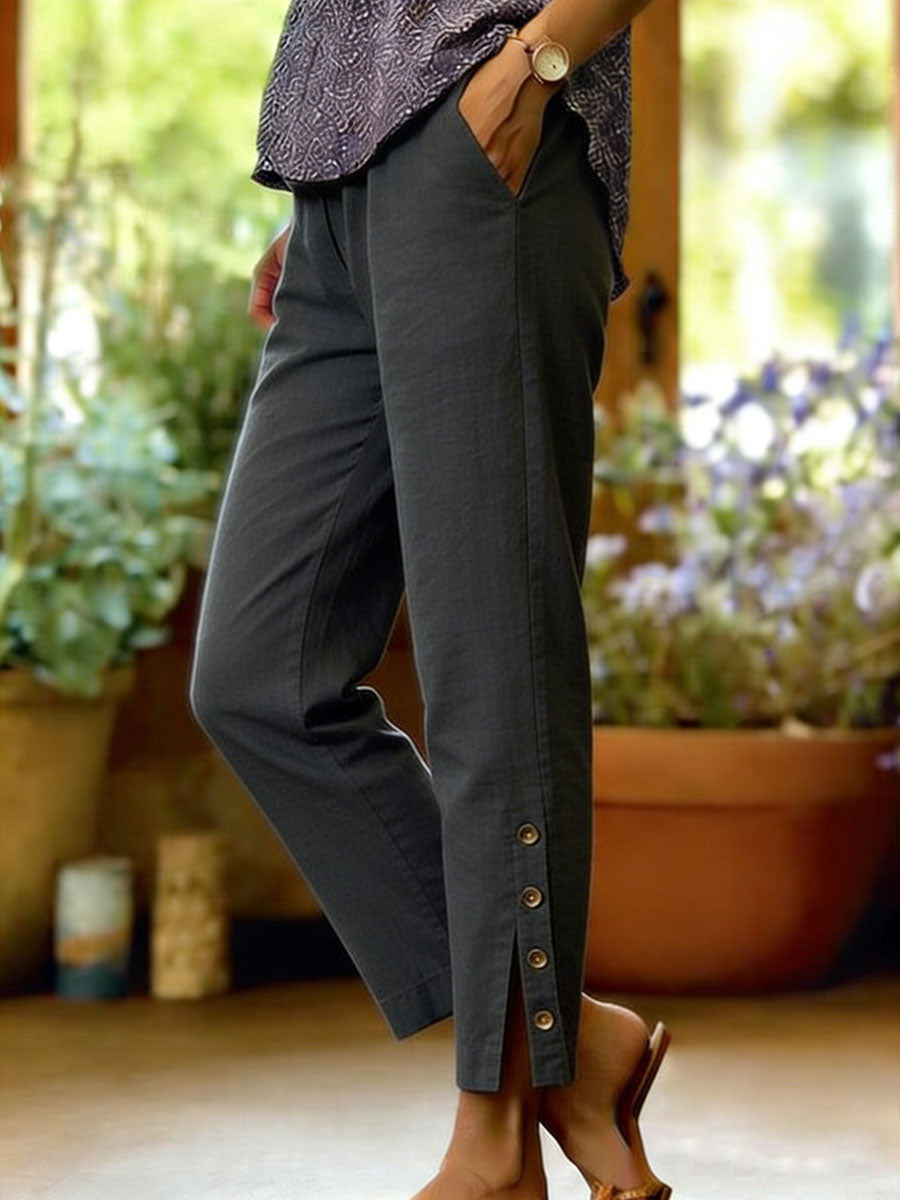 Pantalones de mujer corte suelto con botones laterales. Algodón y lino, perfectos para un look casual relajado.
