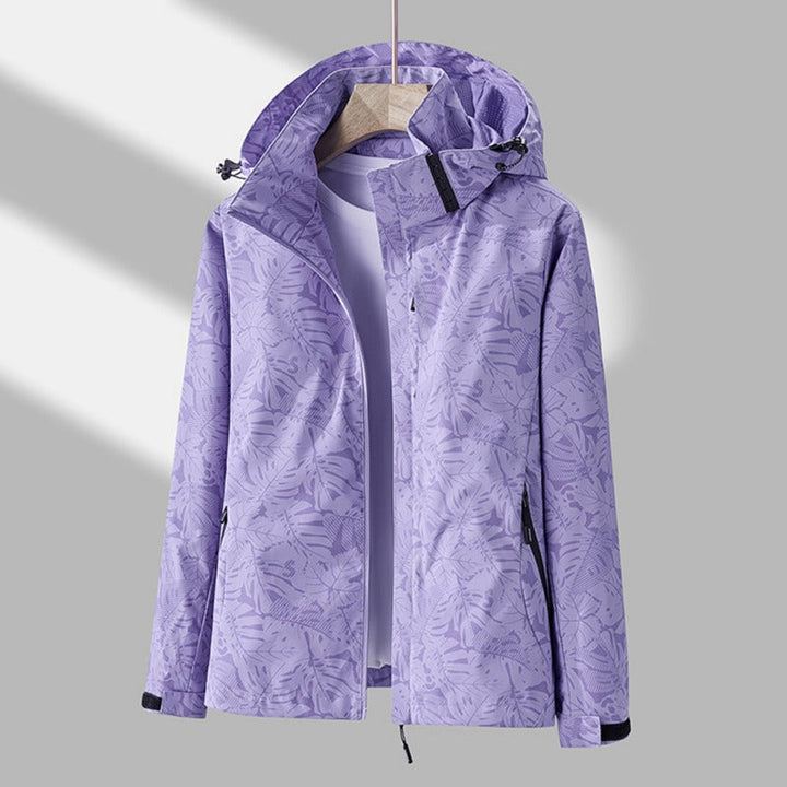 Chaqueta de mujer cortavientos impermeable con capucha. Versátil para invierno, otoño y actividades deportivas al exterior.