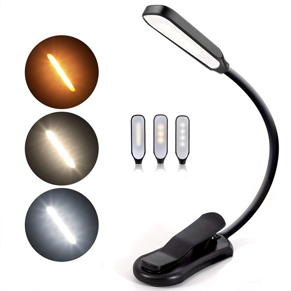 Lámpara de lectura LED con pinza para libros. Luz recargable y portátil, ideal para proteger la vista en escritorio.