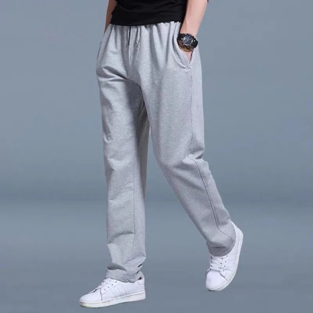 Chándal deportivo para hombre en algodón, diseño moderno y pierna ancha. Perfecto para estilo urbano.