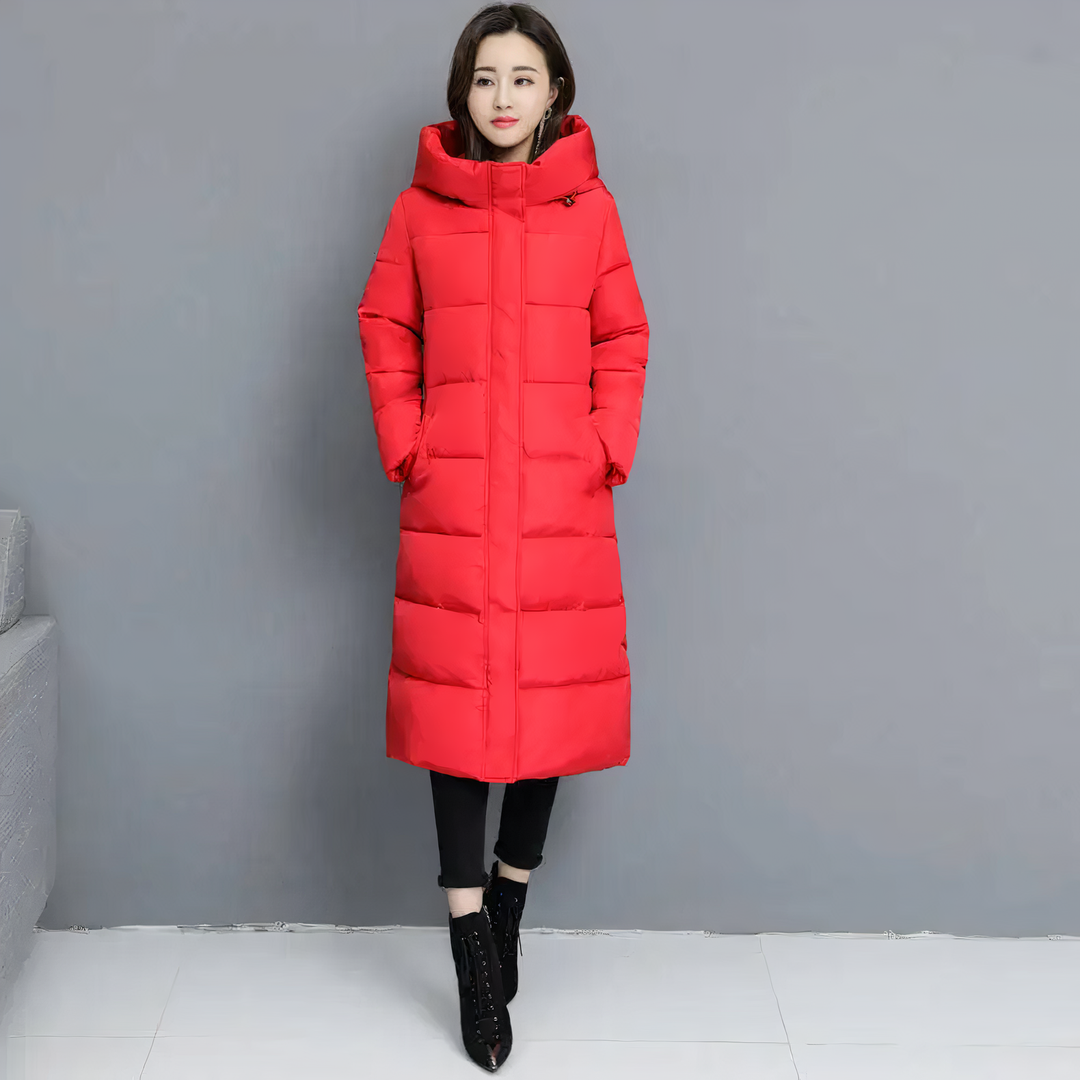 Abrigo largo acolchado negro para mujer, ideal para invierno. Ofrece calidez, elegancia y estilo moderno.