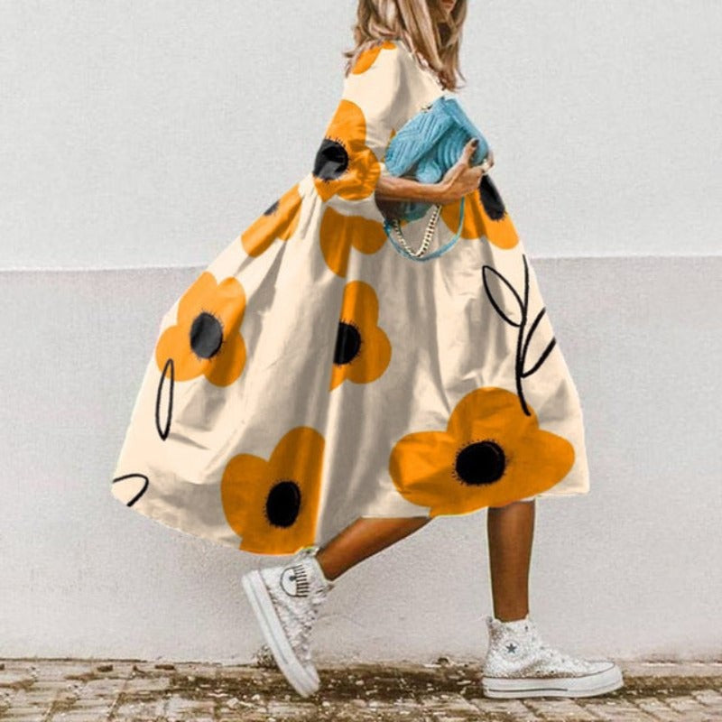 Vestido midi holgado de mujer con mangas abullonadas. Estilo casual elegante, ideal para primavera y verano.
