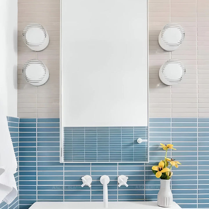 Aplique de pared LED redondo para sala. Genera un ambiente luminoso y moderno con su luz ambiental.