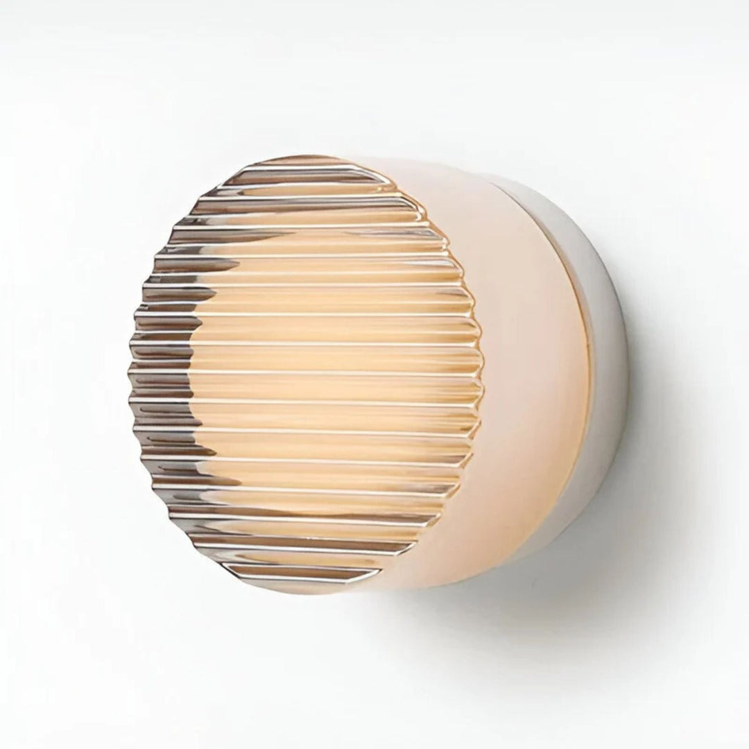 Aplique de pared LED redondo para baño. Diseño moderno con iluminación funcional y elegante.