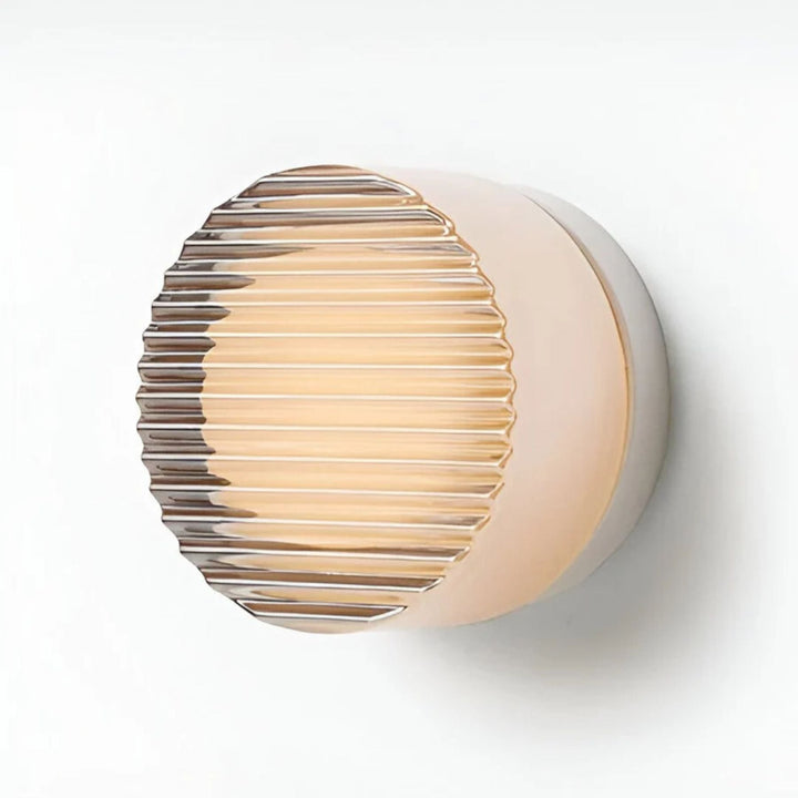 Aplique de pared LED redondo para baño. Diseño moderno con iluminación funcional y elegante.