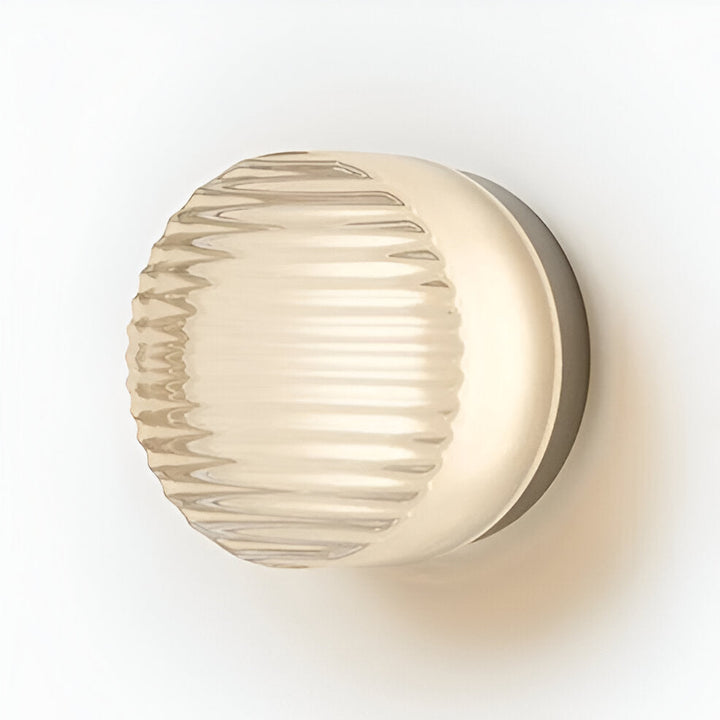 Aplique de pared LED redondo decorativo. Aporta estilo y luz ambiental a pasillos y salas de estar.