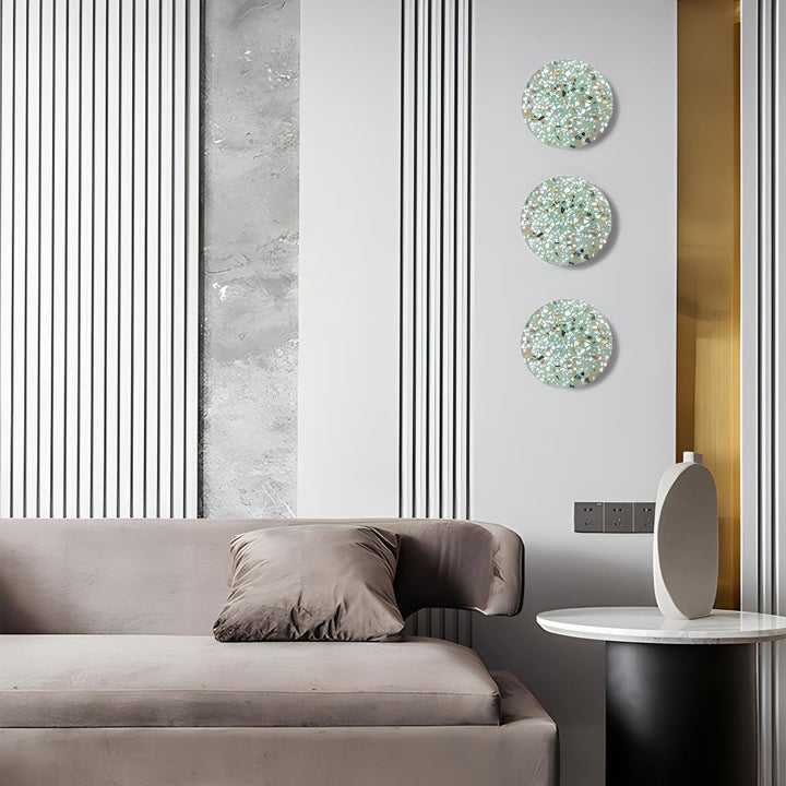 Lámpara de terrazo para pared, diseño nórdico, con halo de luz decorativo y cálido.