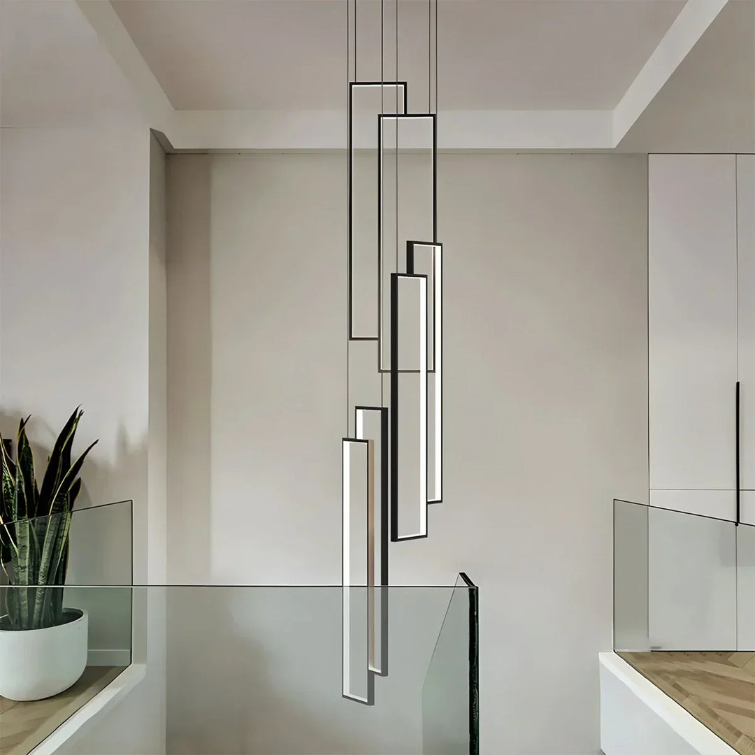 Lámpara araña LED para escalera, rectangular, diseño interior sofisticado y luminoso.