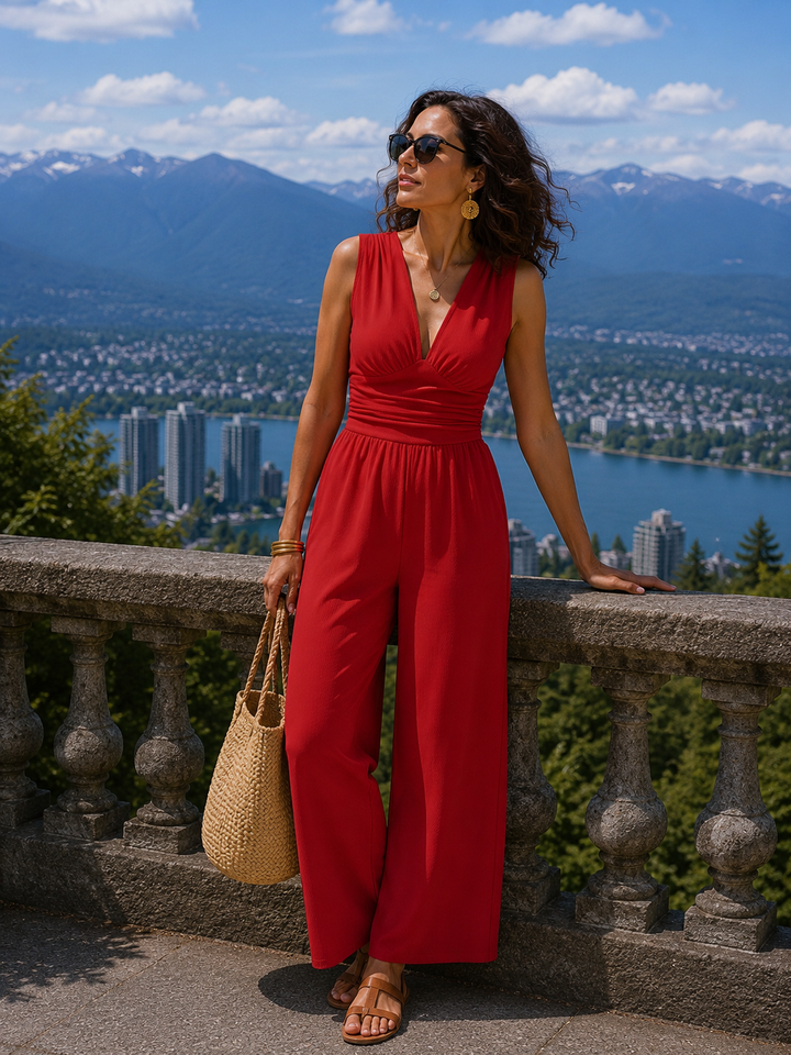 Mono elegante de mujer con escote V y pierna ancha fluida. Ideal para fiestas y ocasiones especiales.