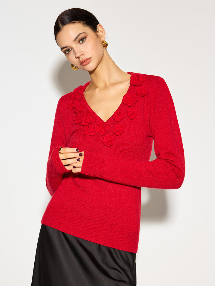 Moda femenina: top de punto rojo vibrante con flores 3D y escote V. Blusa ceñida, ideal para un estilo chic.