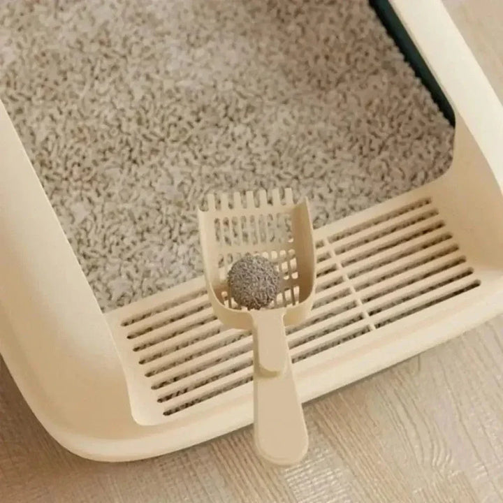 Bandeja de arena para gatos, promueve higiene felina superior y comodidad. Accesorio duradero para mascotas.