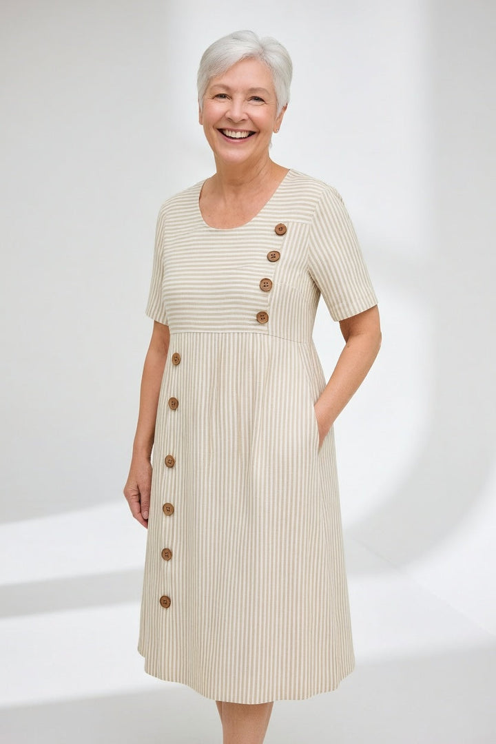 Vestido midi de rayas fluido con bolsillos para mujer, perfecto para un look casual de verano.