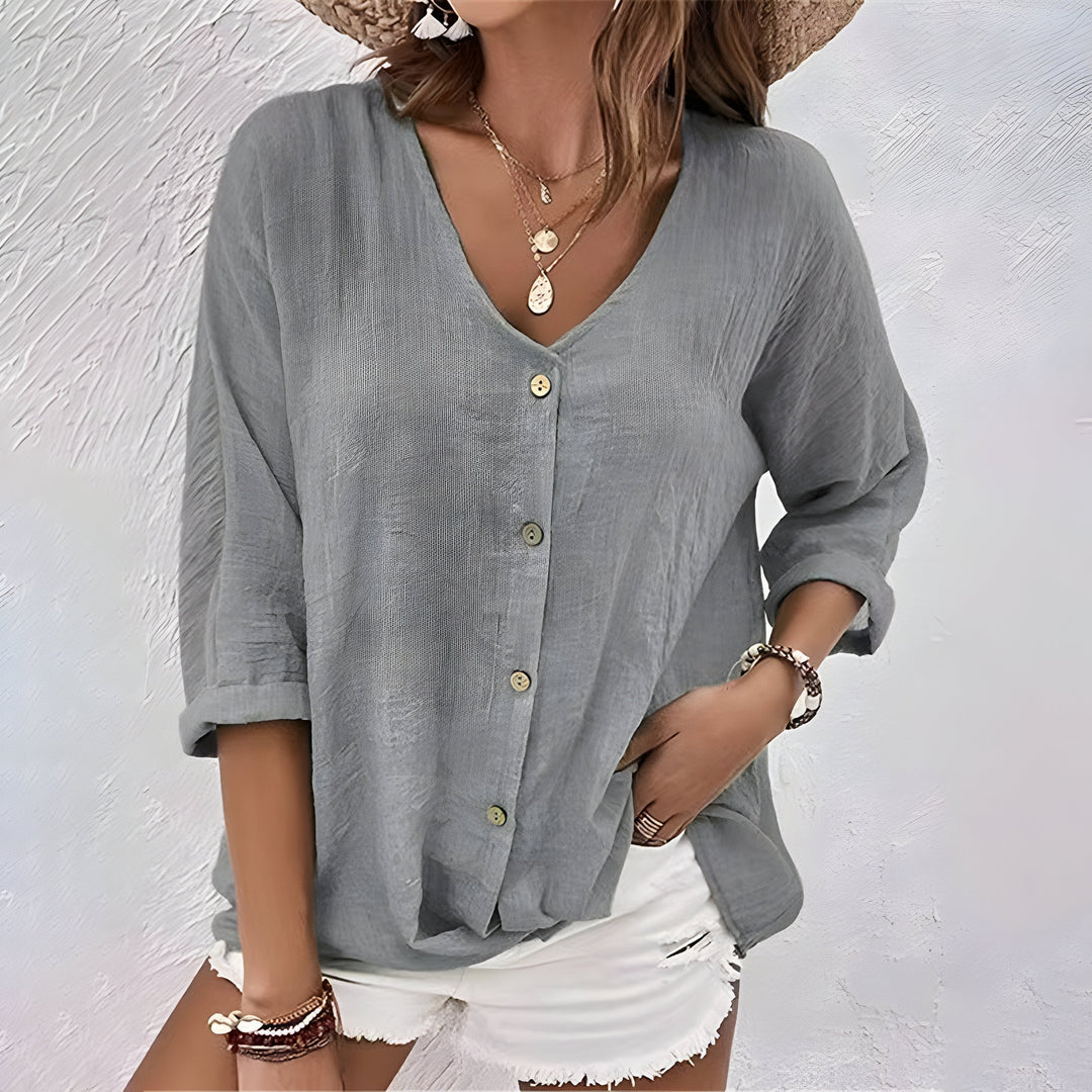 Cómoda blusa mujer cuello V, manga larga. Diseño relajado con botones, perfecta para tops de primavera.