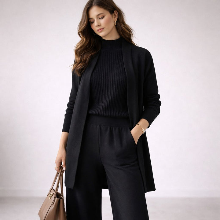 Conjunto de punto de mujer con cárdigan largo y pantalón elástico, moda de invierno cálida y confortable.