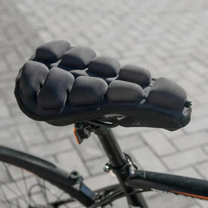 Cojín descompresor unisex para asiento de bicicleta, máxima comodidad y soporte en viajes largos de ciclismo.