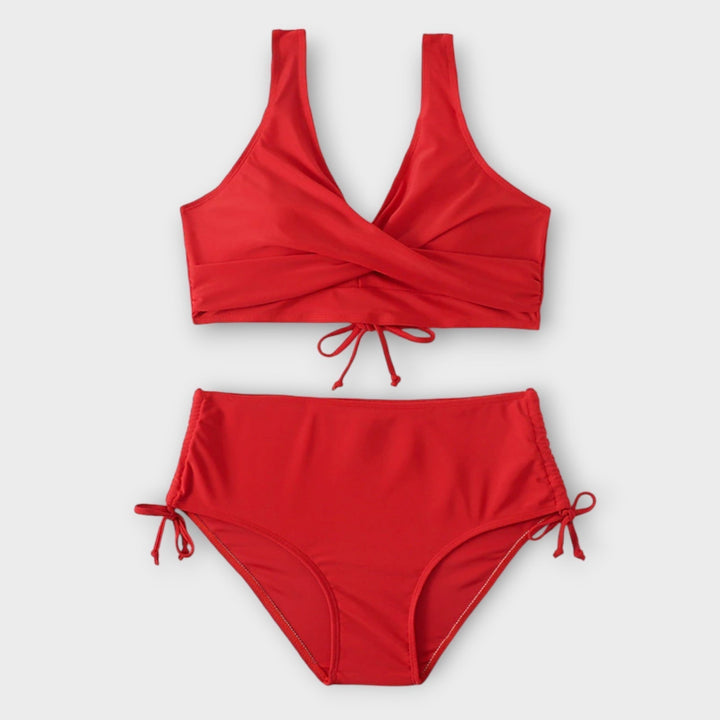 Conjunto de bikini femenino con detalle cruzado en el busto. Perfecta para vacaciones de verano y días de playa.