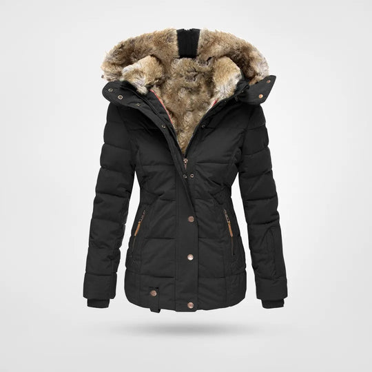 Abrigo acolchado de mujer con capucha. Ideal para el invierno, combina calidez y estilo elegante.