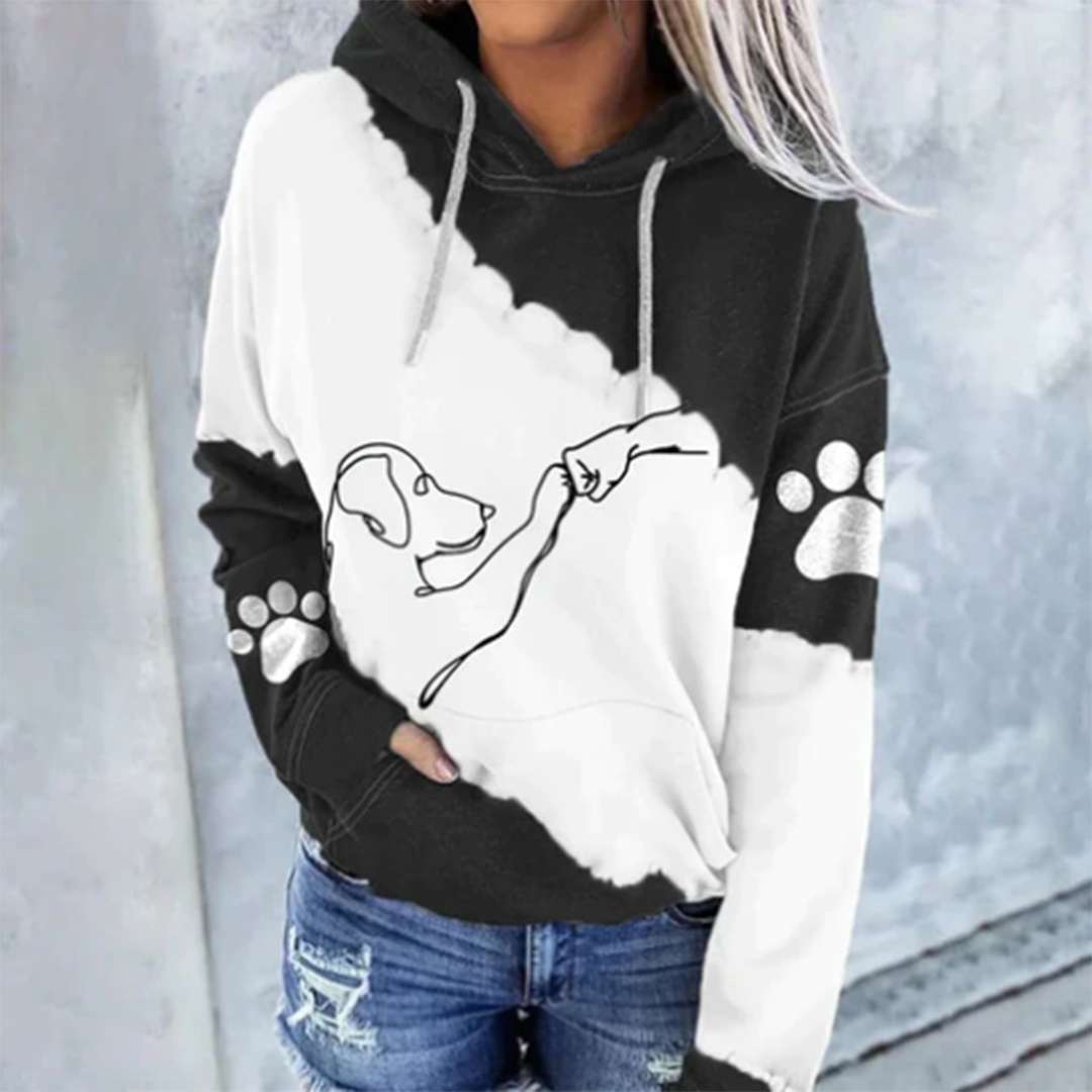 Sudadera de mujer con capucha y estampado de perro, ideal para look casual y moderno de otoño.
