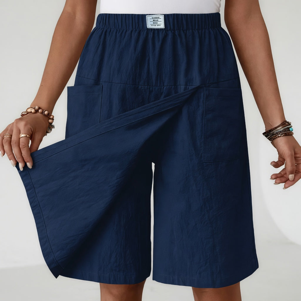 Falda pantalón femenina con cintura elástica fruncida y prácticos bolsillos laterales, moda cómoda para mujer.