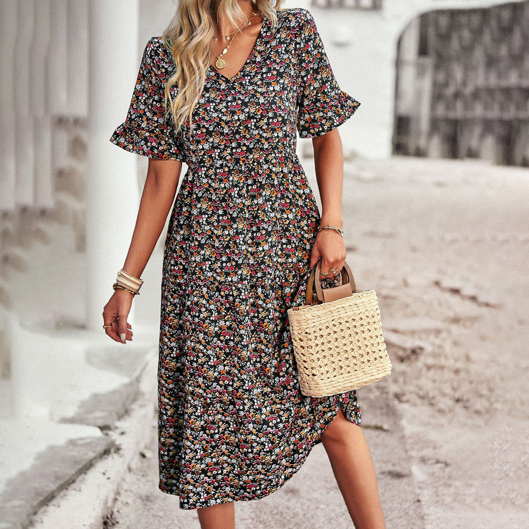 Vestido midi floral con estampado delicado. Elegante y veraniego para mujer, perfecto para fiestas casuales.