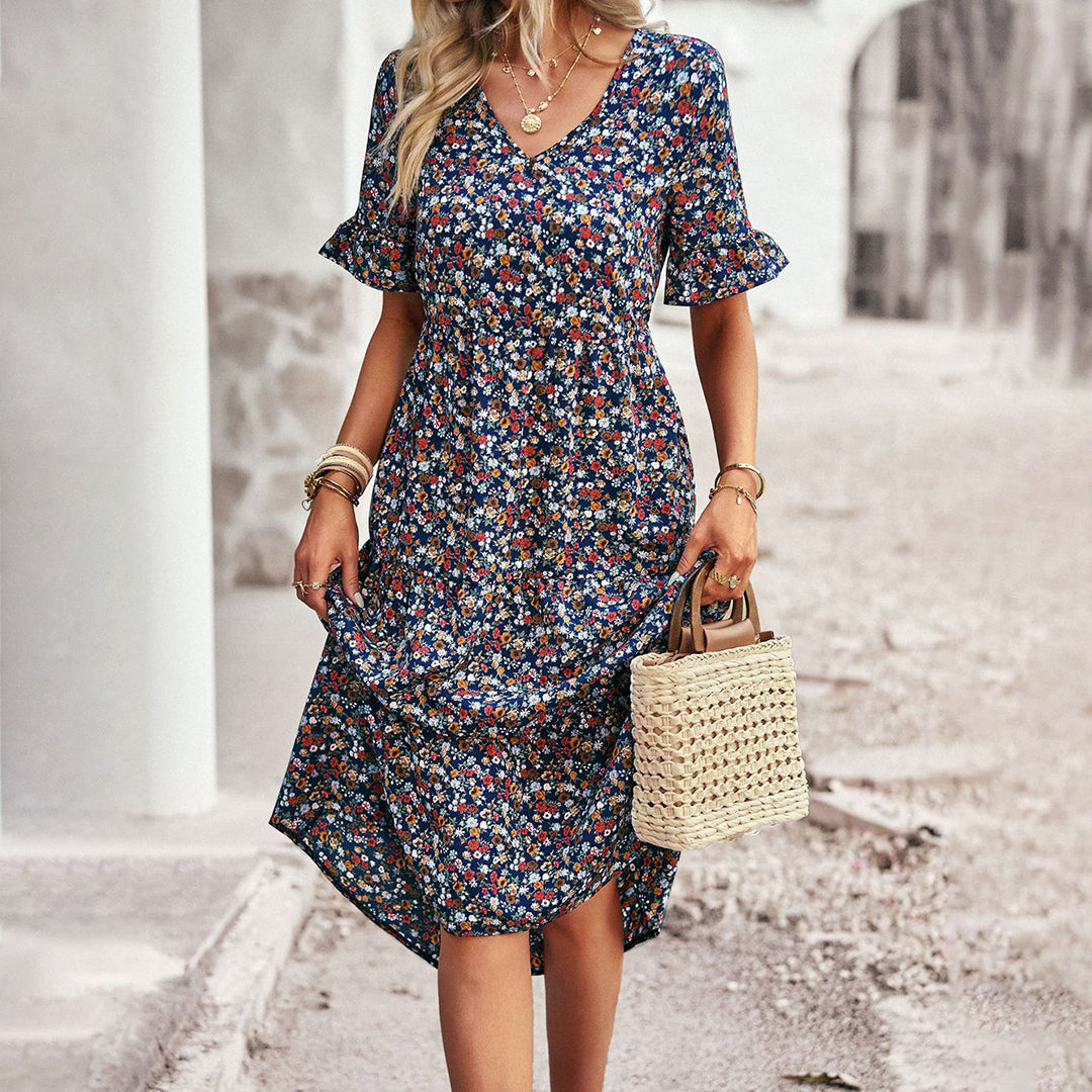 Vestido de mujer midi floral con caída elegante. Fresco y cómodo, ideal para looks de verano y casuales.