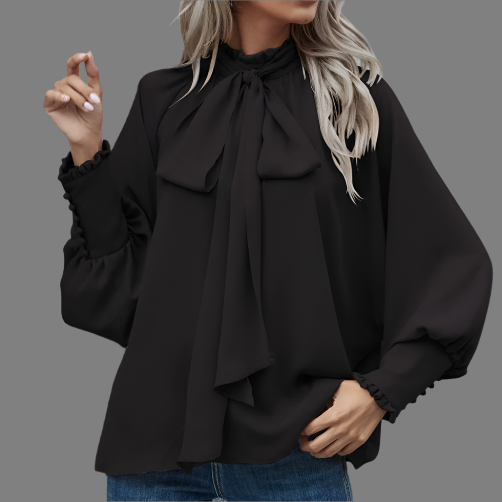 Blusa femenina con lazo frontal y mangas largas. Prenda elegante y sofisticada para cualquier ocasión.