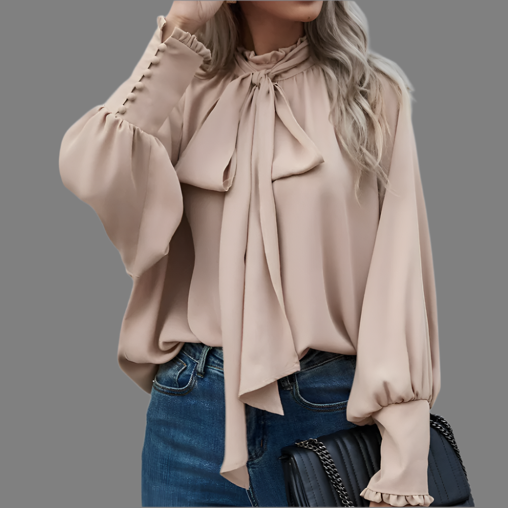 Blusa elegante de mujer con lazo en cuello y mangas largas. Ideal para oficina y estilo formal.