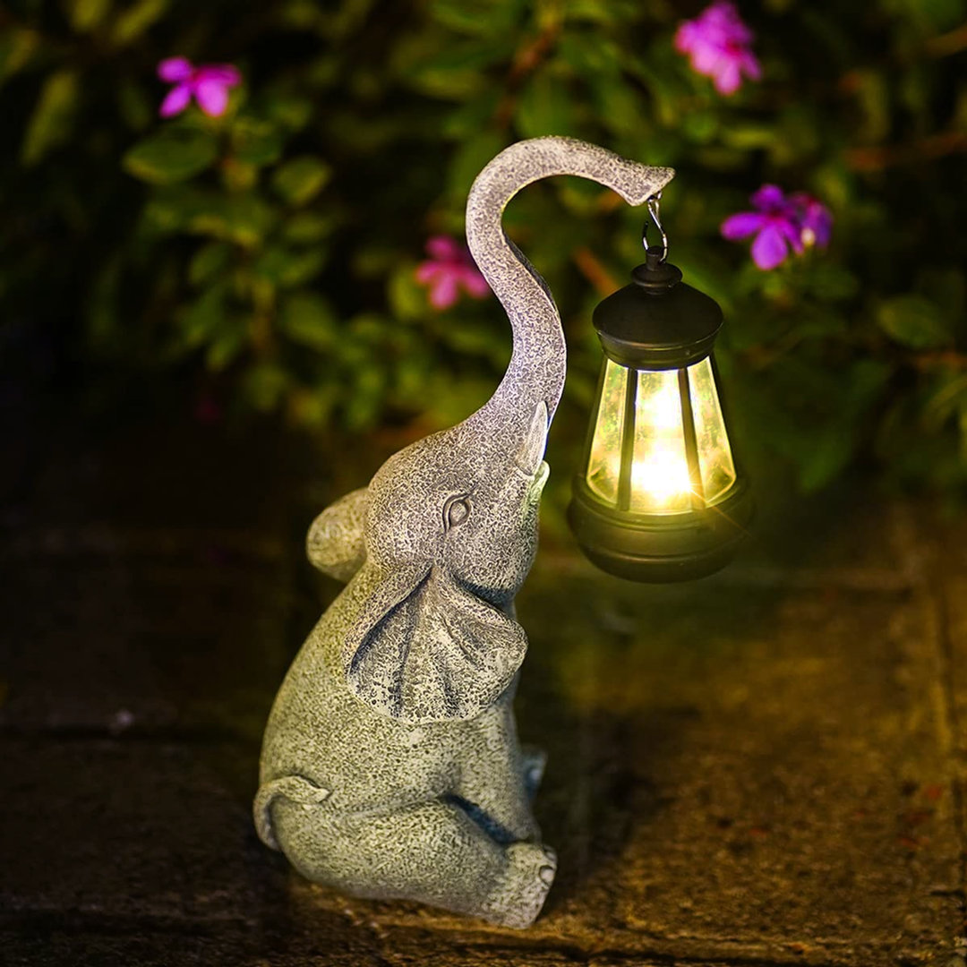 Lámpara de jardín solar con diseño de elefante. Perfecta para decoración exterior y luz ambiental.