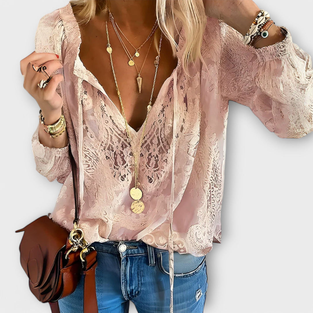 Blusa femenina de manga larga con volantes decorativos y lazo. Estilo sofisticado para blusa de mujer.