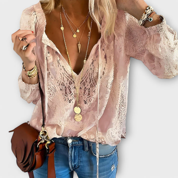 Blusa femenina de manga larga con volantes decorativos y lazo. Estilo sofisticado para blusa de mujer.
