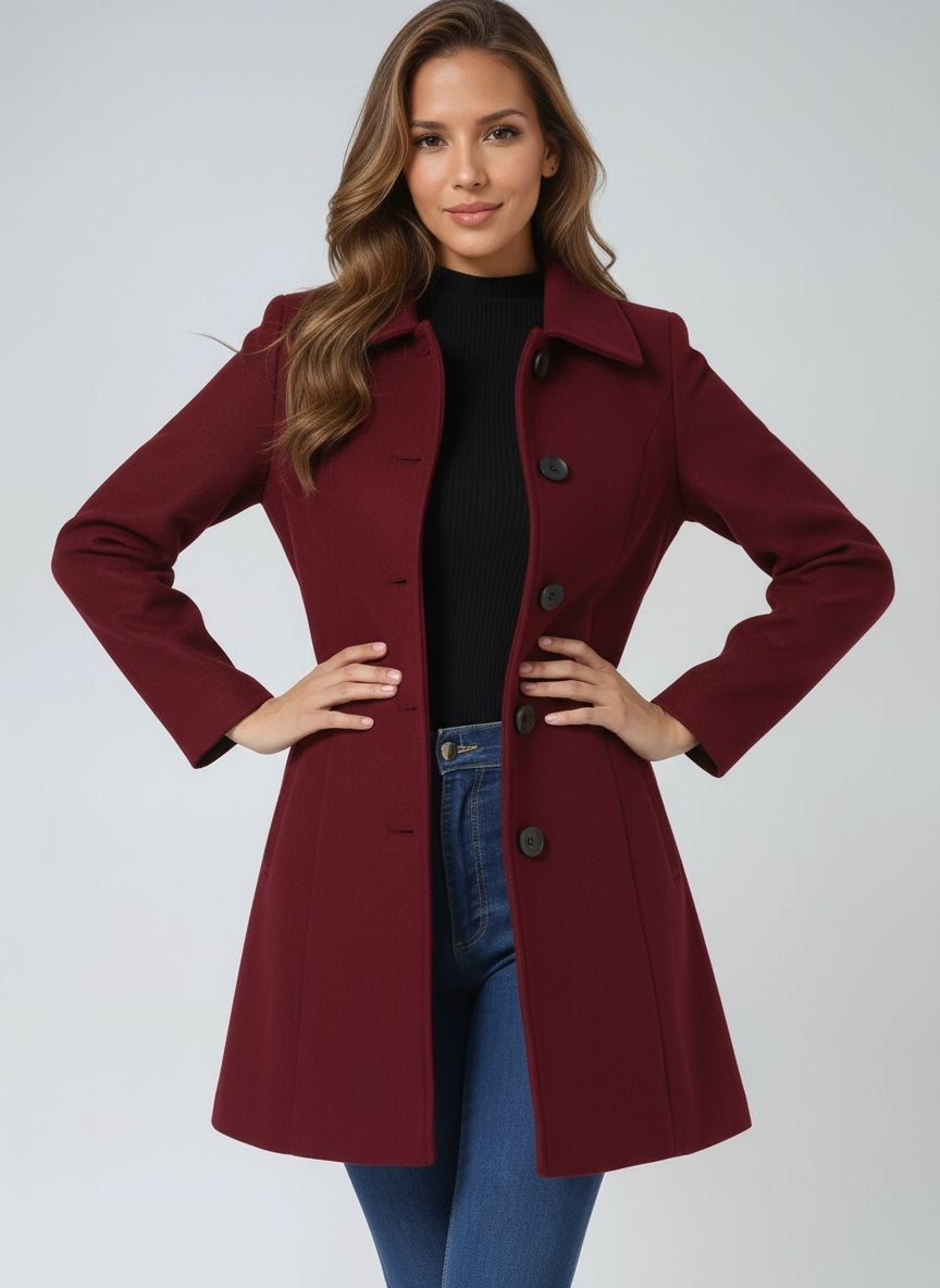 Abrigo largo de mujer con diseño atemporal, cuello solapa y botones, elegante para cualquier ocasión.