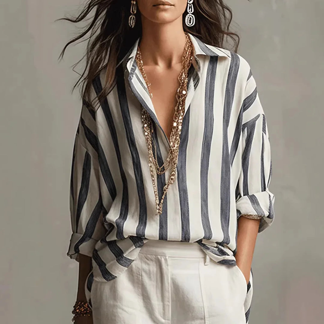 Camisa de mujer a rayas con cuello solapas y manga larga. Ideal para un look casual diario y moda femenina.