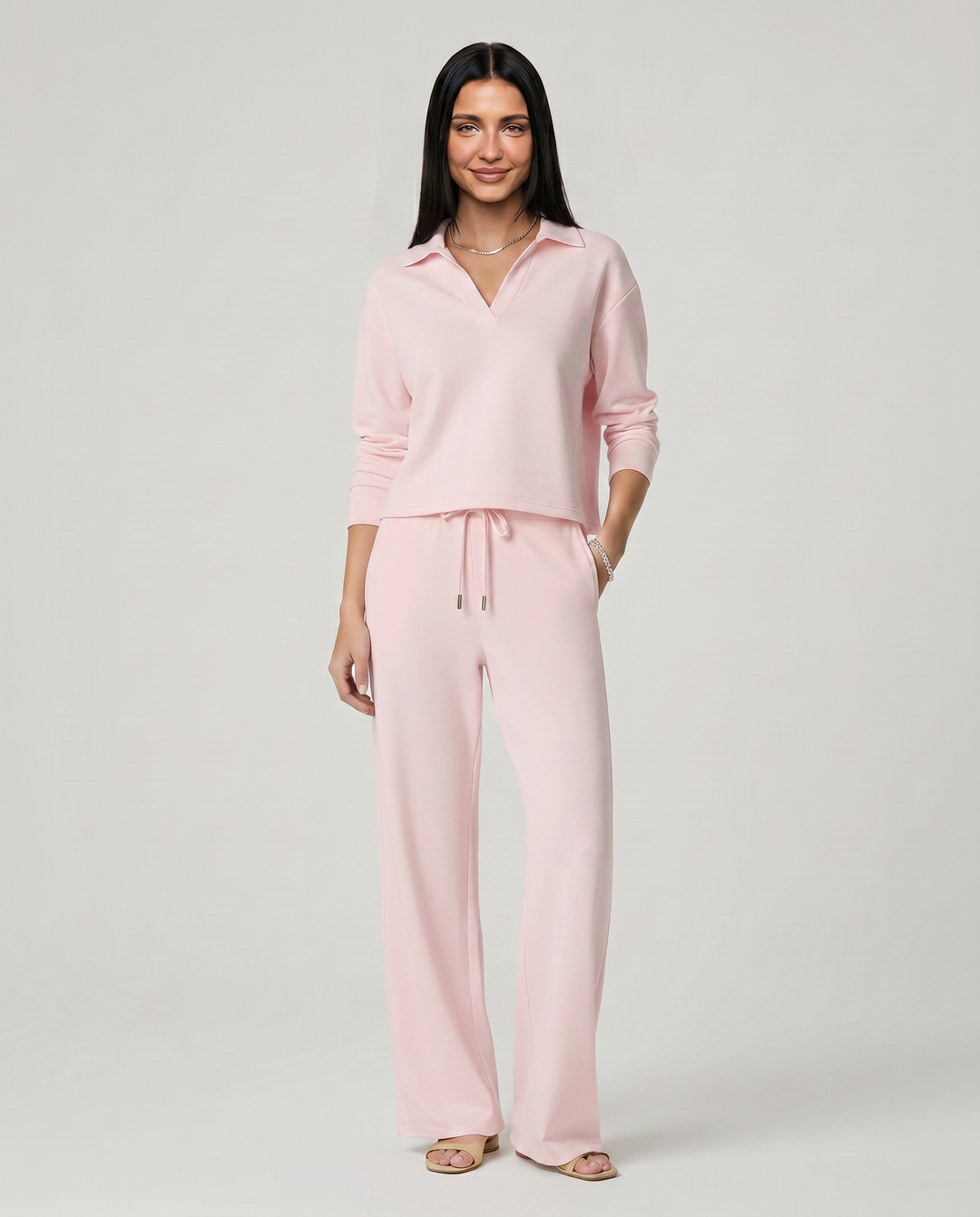 Conjunto de punto con suéter cuello V y pantalón ancho, diseño moderno para mujer. Ideal para un look casual.
