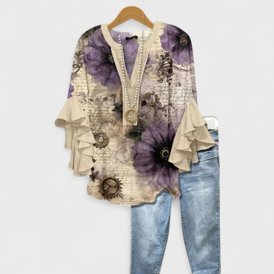 Blusa casual mujer Celia con estampado floral vibrante y volantes elegantes.