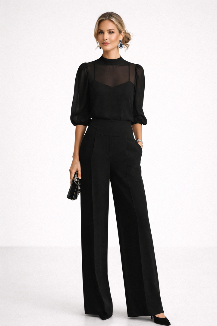 Jumpsuit negro de mujer, mono largo y holgado para máxima comodidad. Moda femenina elegante y casual de verano.